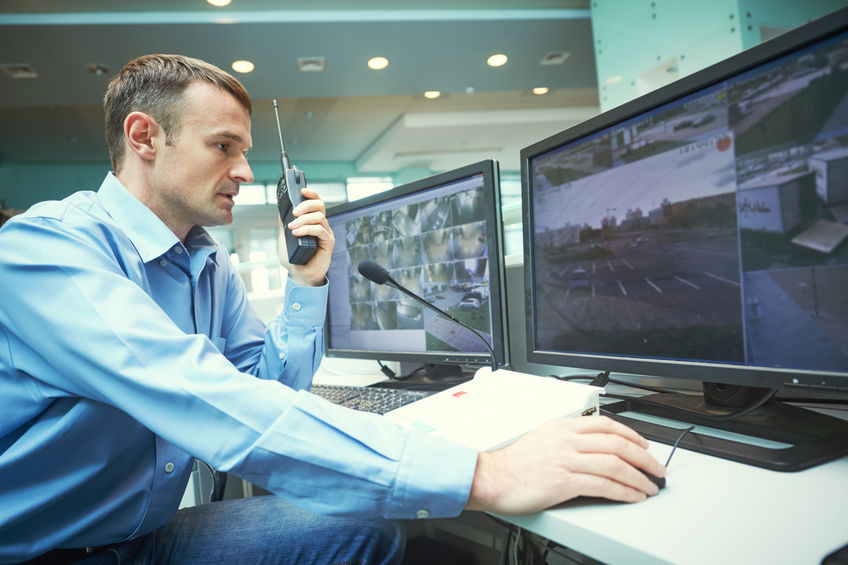 security guard monitoring screens